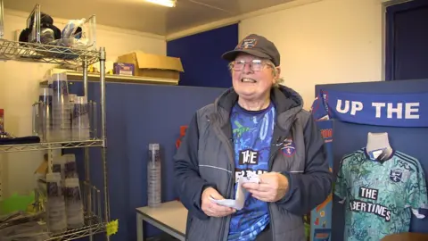 Maggie, Terry's mum and Frankie's sister, in the club shop