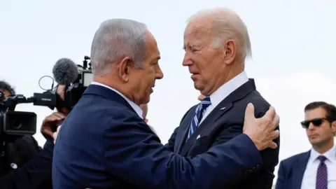 Reuters Netanyahu and Biden embrace during Biden's visit to Israel in October 2023