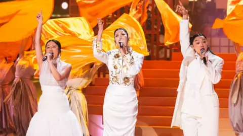 Getty Images Rei Ami, Ejae and Audrey Nuna perform the KPop Demon Hunters track Golden at the Academy Awards