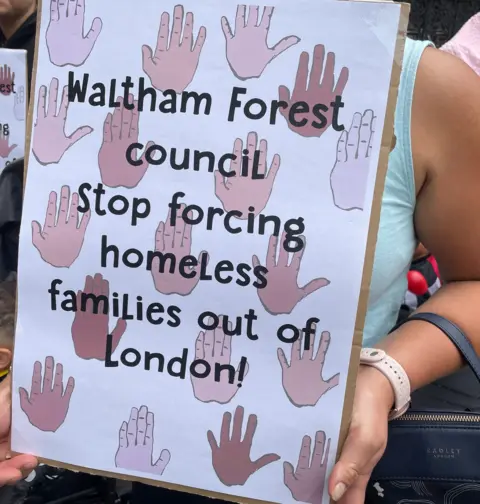 Woman holding a poster 