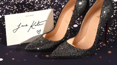 Ewbank's Auction/PA Wire Christian Louboutin shoes donated to the auction by Kate Moss