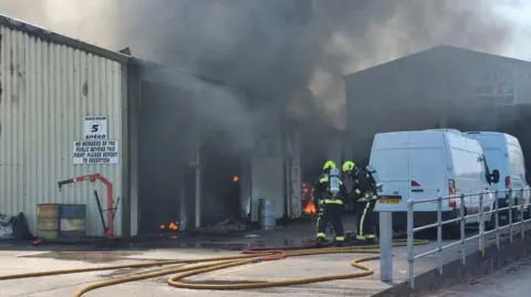 Newton Abbot Fire Station Firefighters tackling garage fire in Heathfield