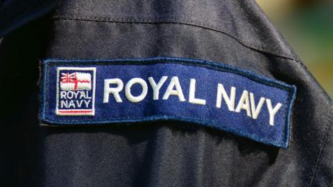 A generic picture of a Royal Navy logo patch on a uniform