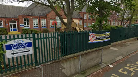 Google Signage on the fences at Rydal Academy warns motorists not to stop on zig zags