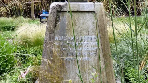 Gerald England Memorial stone reading: 'William Marsden who originated the Saturday half-day Holiday and was buried in this churchyard.'