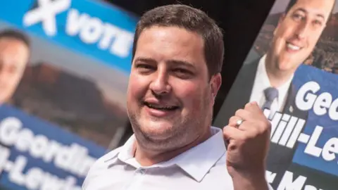 Gallo via Getty Images Geordin Hill-Lewis is seen at a campaign event in Cape Town