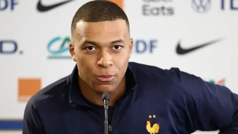 Kylian Mbappe speaks at a news conference