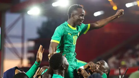Cheikh Sabaly celebrates