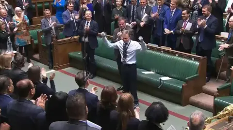 UK Parliament/PA Craig Mackinlay received a rare standing ovation when he returned to the Commons after a life-threatening episode of sepsis