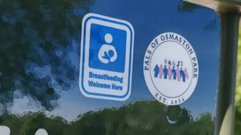 Derby City Council A sign that says "Breastfeeding welcome here" and a logo for Pals of Osmaston Park