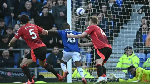 Everton's Ashley Young goes down in the box