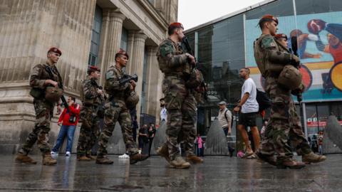 French military personnel patrol outside Gare du Nord station in Paris