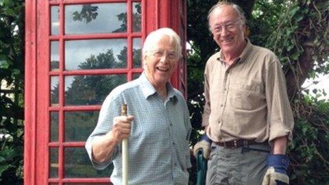 David Berridge and Brian Taylor outside the phone box in Ufford