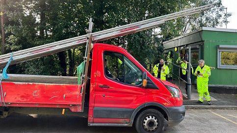 A lorry with unsafe scaffolding