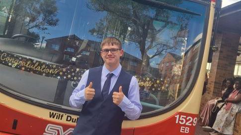 Josh with the double decker bus which took him to his school prom 