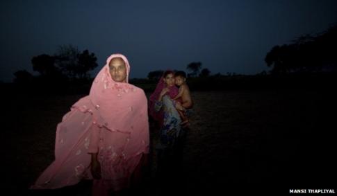 Women at night in the fields