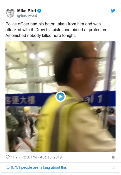Twitter post by @Birdyword: Police officer had his baton taken from him and was attacked with it. Drew his pistol and aimed at protesters. Astonished nobody killed here tonight. 