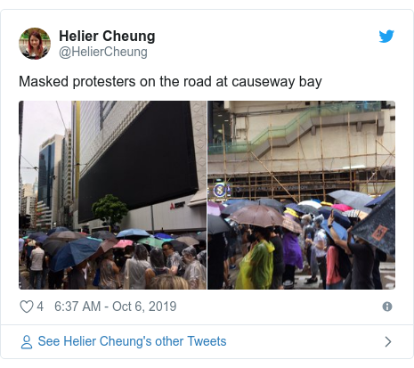 Twitter post by @HelierCheung: Masked protesters on the road at causeway bay 