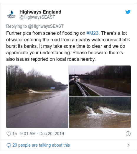 Twitter post by @HighwaysSEAST: Further pics from scene of flooding on #M23. There's a lot of water entering the road from a nearby watercourse that's burst its banks. It may take some time to clear and we do appreciate your understanding. Please be aware there's also issues reported on local roads nearby. 