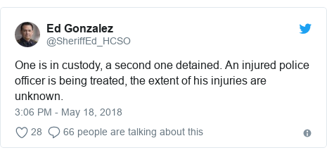 Twitter post by @SheriffEd_HCSO: One is in custody, a second one detained. An injured police officer is being treated, the extent of his injuries are unknown.