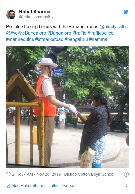 Twitter post by @rahul_sharma83: People shaking hands with BTP mannequins @blrcitytraffic @WeAreBangalore #Bangalore #traffic #trafficpolice #mannequins #stmarksroad #bengaluru #namma 
