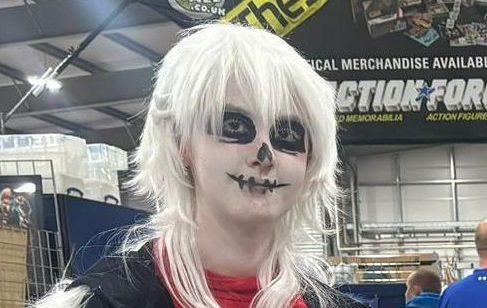 Participant wearing skeleton face paint at Comic Con NI