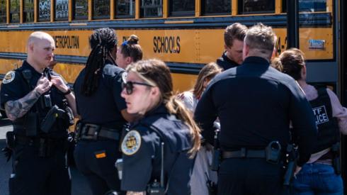 School buses with children arrive at Woodmont Baptist Church to be reunited with their families after a mass shooting at The Covenant School on March 27, 2023 in Nashville, Tennessee.