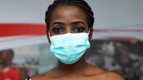 A woman in Nigeria in a face mask