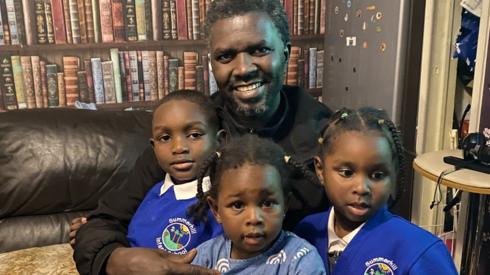 Yousif and his three children at a friend's house for dinner.