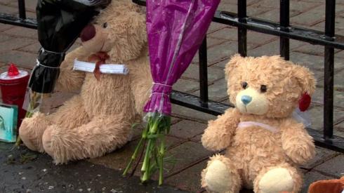 Toys and flowers left at the scene of the incident in 2021
