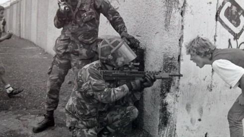 A woman has an argument with soldiers at Whiterock in Belfast