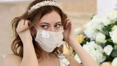 Bride wearing a mask