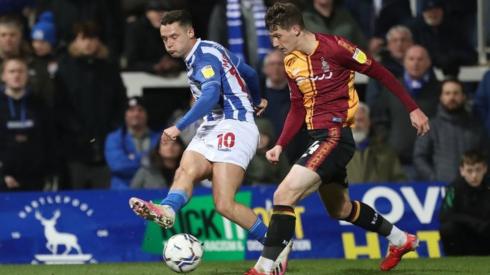 Luke Molyneux of Hartlepool United in action with Matty Foulds of Bradford City