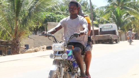 Pelé Bambina on a mota taxi in Pemba, Mozambique