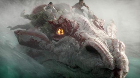 People riding a dragon in a scene from Shang-Chi and the Legend of The Ten Rings