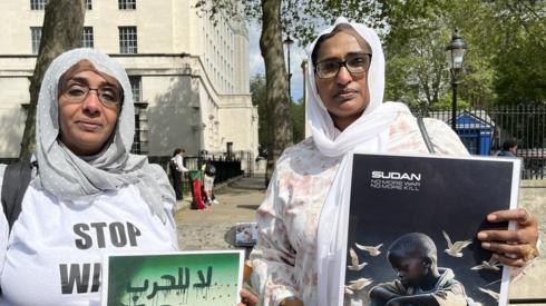 Two protestors against Sudan.