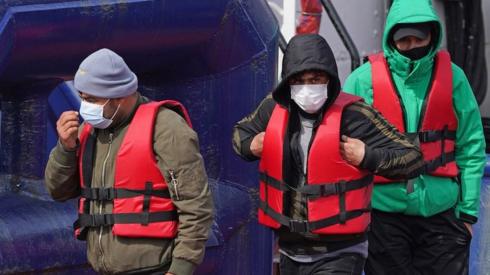 A group of people thought to be migrants are brought in to Dover, Kent