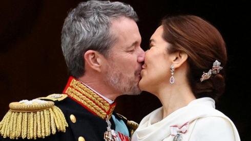 King Frederik kisses his wife Queen Mary