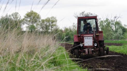 A farmer works on a field near Lviv, Ukraine, 09 May 2022.
