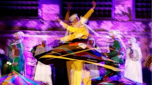 An Egyptian troupe performs the traditional Tanoura (skirt) dance during the Muslim holy month of Ramadan, at el-Ghuri Culture Palace in Cairo, on April 20, 2022.