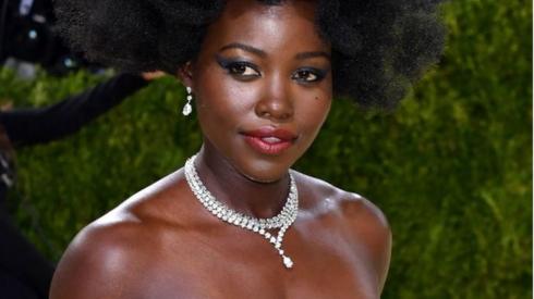 Lupita Nyong'o poses on the red carpet.