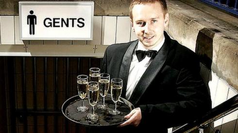 champagne waiter at toilet