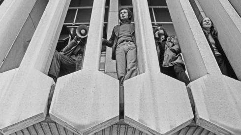 Black and white photo of protesters occupying the Centre Point building on 20 January 1974