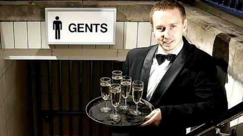 champagne waiter at toilet