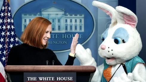 An Easter Bunny stands next to White House Press Secretary Jen Psaki as she delivers the daily briefing in the Brady Briefing Room of the White House in Washington, DC, US, on 18 April 2022