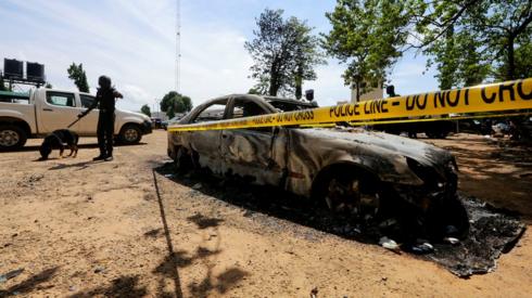 A burnt out car near the Kuje Medium prison on 6 July