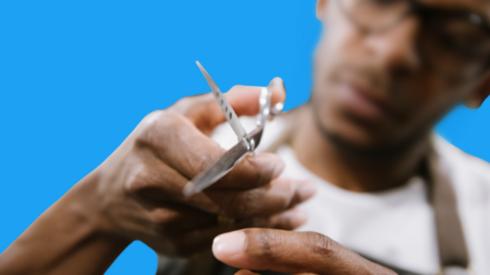 A man using scissors