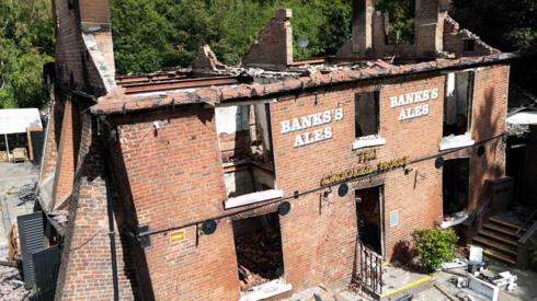 The burnt out remains of The Crooked House pub near Dudley seen on 7 August 2023