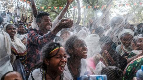 Ethiopian Orthodox worshippers at the compound of Fasilides Bath during the celebration of Timket, the Ethiopian Epiphany, in the city of Gondar, Ethiopia – 19 January 2022