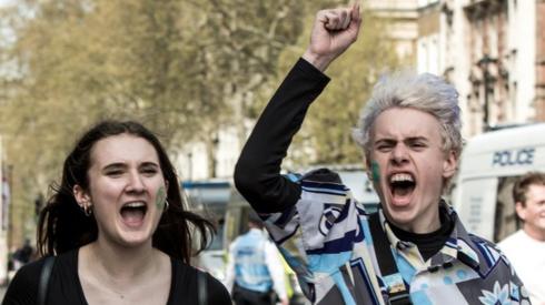 Two Extinction Rebellion protesters holding a banner